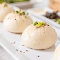 Q-Bao(Pan-Fried Pork Buns) (4 Pcs) 特色煎包 · These buns are filled with moist Berkshire-Duroc pork and secret recipe aspic. After being s...