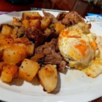 Corned Beef Hash & Eggs · Consuming raw or undercooked meat, poultry, seafood, or eggs may increase your risk of foodb...