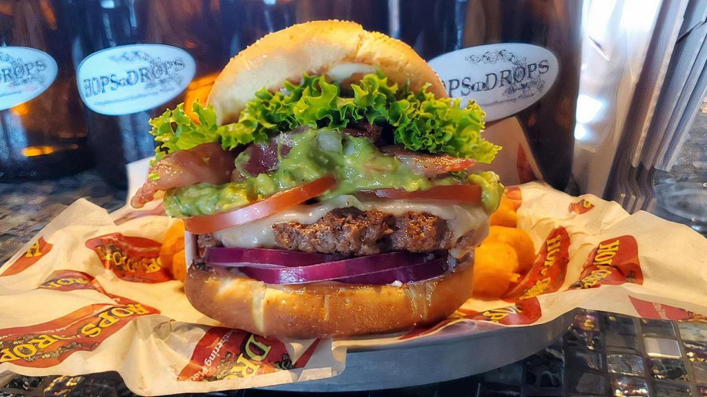 Guacamole Burger · Served with lettuce, tomato, red onion, and mayo. Topped with Swiss cheese, our fresh guacamole and bacon.