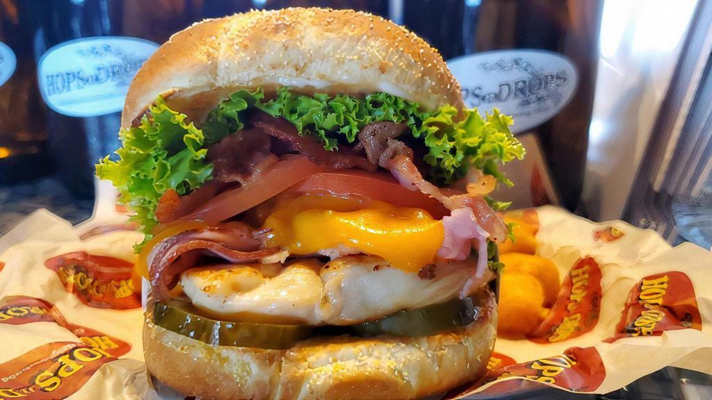 Chicken Sandwich · Served with a grilled chicken breast, cheddar cheese, bacon, shaved ham, mayo, pickles, lettuce and tomato. One great chicken sandwich!