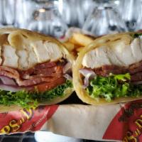 Chicken Club Wrap · Grilled chicken breast, bacon, Swiss cheese, lettuce, tomato, red onion and HopsnDrops sprea...