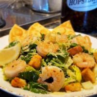 Caesar Salad With Prawns · Sautéed prawns, Romaine lettuce, Parmesan cheese, and croutons. Served with Caesar dressing ...
