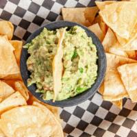 Guacamole & Chips · Fresh guacamole made with avocado, tomato, onion, cilantro and jalapeño.  Served with house-...