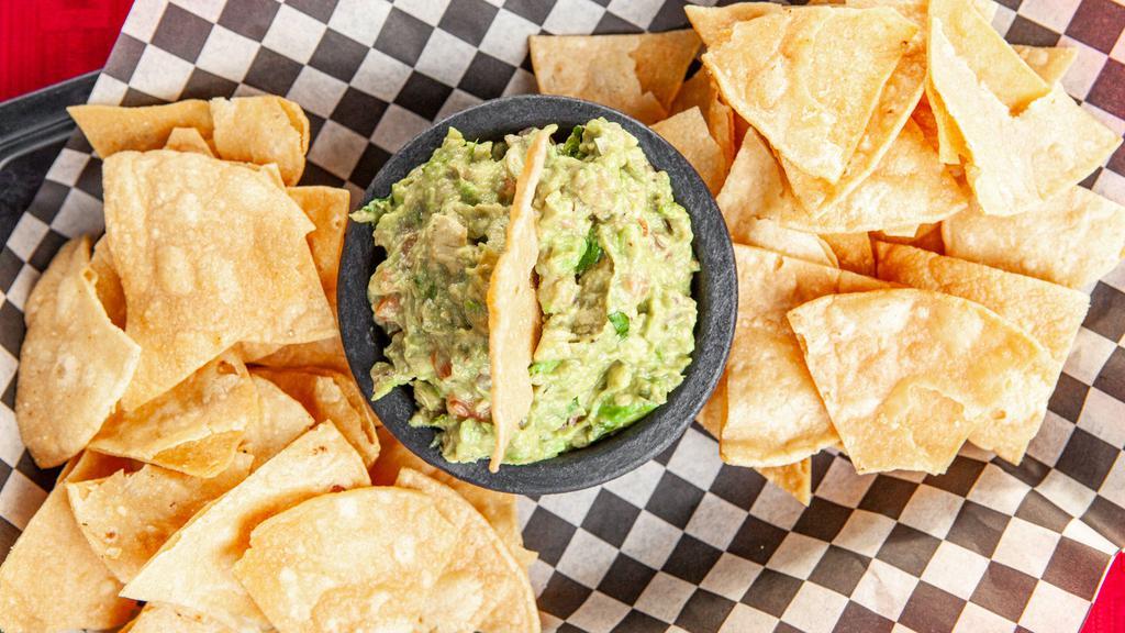Guacamole & Chips · Fresh guacamole made with avocado, tomato, onion, cilantro and jalapeño.  Served with house-made tortilla chips.
