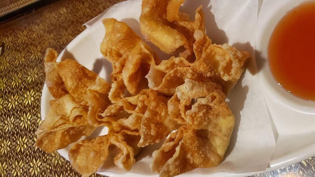 Crab Delight · Wonton wrapper filled with imitation crab, cream cheese then deep-fried. Served with sweet and sour sauce.
