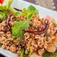 Laab · Your choice of minced chicken or pork prepared with onion, cilantro, mint and rice powder in...