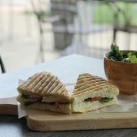 Pesto Chicken  Panini And Seasonal Salad · Chicken, bacon, red onion, Swiss cheese, spinach and tomato.