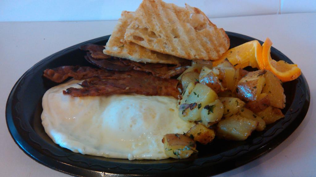 American Breakfast · Two eggs your way, choice of bacon, sausage or ham, toasted ciabatta bread & home fries