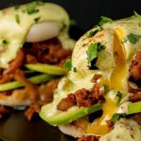 Chorizo Benedict · Served on focaccia bread with chorizo, poached eggs, hollandaise sauce, topped with avocado ...