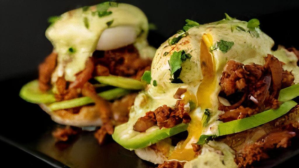 Chorizo Benedict · Served on focaccia bread with chorizo, poached eggs, hollandaise sauce, topped with avocado & side of home fries