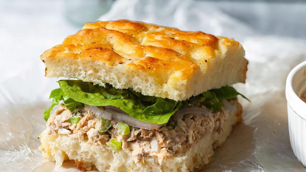 Tuna Sandwich · Albacore tuna, lettuce, tomato, sprouts, avocado, Swiss cheese & house dressing on focaccia bread