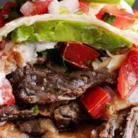 Carne Asada Burro · Our burros are made with a traditional flour tortilla filled with fresh cabbage, grilled car...