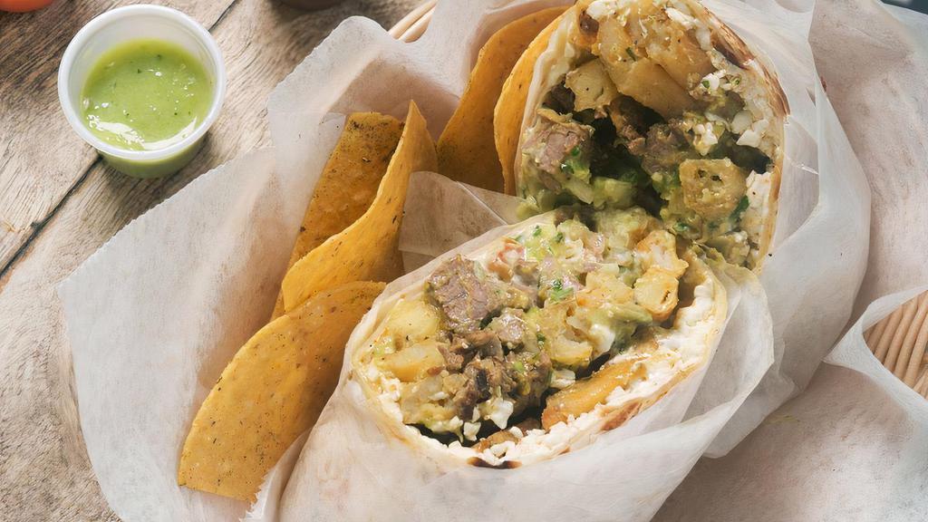 Chicken Burro · Our burros are made with a traditional flour tortilla filled with fresh cabbage, grilled chicken, pico de gallo, guacamole salsa, and cheese.