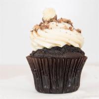 Peanut Butter Cup Cupcake
 · Our moist chocolate cake topped with peanut butter cream cheese frosting and chopped Reese's...