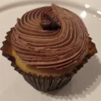 Vanilla-N-Chocolate Cupcake · Our vanilla bean cake topped with smooth chocolate buttercream and dark chocolate shavings.