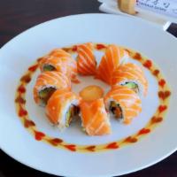 Salmon Salmon Love Roll · In: spicy Salmon, cucumber, and avocado. Out: Salmon with 4 specialty sauces.