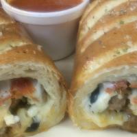 Deluxe Stromboli · Sausage, pepperoni, olives, onions, green peppers, mushroom and cheese.