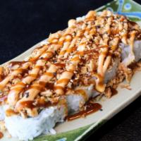 Blossom Crunch Roll · Tempura crab, avocado, cucumber, with onion crunchies, spicy sauce & sweet sauce on top.