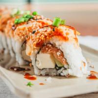 Zen Roll * · Salmon, cucumber, cream cheese, lemon slices, spicy crab, sweet sauce & green onions on top....