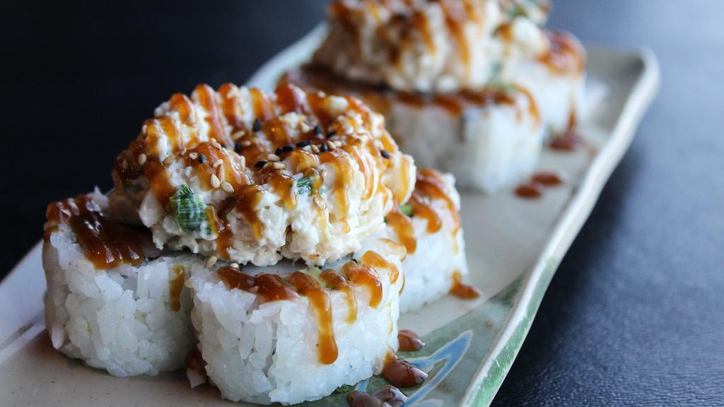 Scallop Volcano Roll · Crab, avocado with cooked scallop, green onion & sweet sauce on top.
