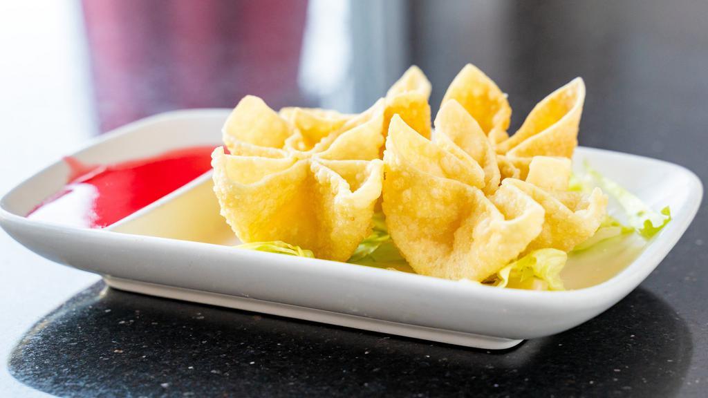 Crab Rangoons (4) · Extra crispy wontons filled with crab meat and a cream cheese base.