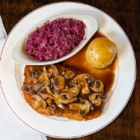 Jaeger Schnitzel · Breaded pork loin deep-fried to golden perfection, covered in a brown mushroom gravy.