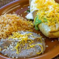 Chimichanga · Shredded beef or chicken (cooked with bell pepper, onion and tomato). Served with rice and r...
