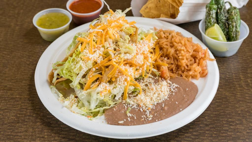 Beef Taco & Cheese Enchilada · Shredded beef taco and cheese enchilada Served with Rice and Refried Beans (No substitutions.)
