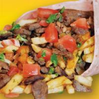 Machaca · Shredded beef with eggs, beef is cooked with bell peppers, onion and tomatoes.