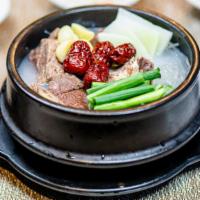 Galbi Tang · Gluten free. Hearty short rib stew, green onions, and egg with potato noodle.