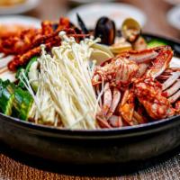 Maeun Tang · Gluten free. Spicy seafood stew, cod fish, radish, tofu, green mussel and clam.