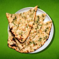 Divine Garlic Naan(Vegan) · Indian bread topped with garlic and cilantro, baked in a clay oven