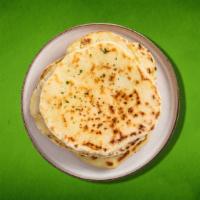 Naan Mania (Vegan) · Soft white Indian bread, baked in a clay oven