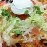 Enchiladas Verdes · Two Corn or one flour tortillas stuffed with your choice of meat (chorizo, chicken, or carni...