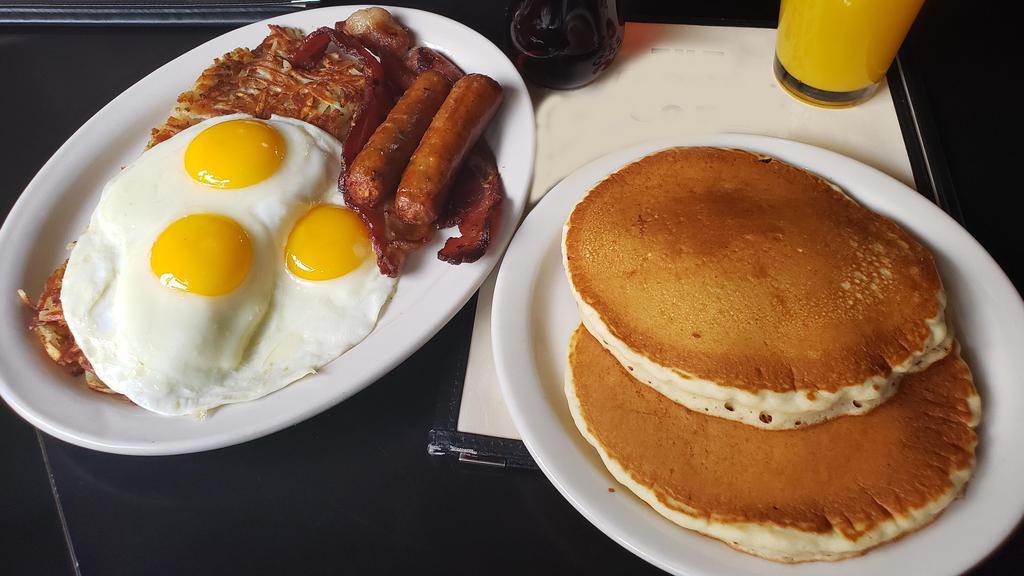 The Deck Hand · Three extra-large eggs any style, two strips of bacon, two links, two hotcakes and hash browns. For the hearty appetite!.