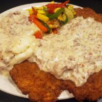 Chicken Fried Steak · Served with country sausage gravy, served with mashed potatoes and veggies. Spice it up with...