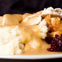 Hot Turkey Sandwich · House roasted turkey with mashed potatoes and cranberry sauce, served open-faced on egg brea...