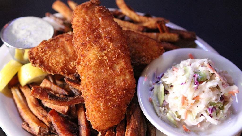Fish & Chips · Alaskan cod fillets, fried to a golden brown, served with tartar sauce, coleslaw and a mound of our hand-cut fries.