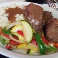 Pot Roast · A house specialty. Slow roasted, seasoned beef, served with beef gravy, mashed potatoes and ...