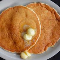 Short Stack Pancakes · Three fluffy buttermilk pancakes.