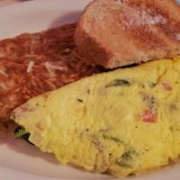 Veggie Omelette · Spinach, tomato, onions, mushrooms and cheddar cheese.