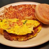Steak Omelette · Slices of steak grilled with fresh green peppers, onions, mushrooms, tomatoes and hash brown...