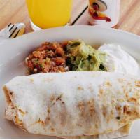 Breakfast Burrito · With three scrambled eggs, red potatoes, spicy black beans and pico de gallo in a large flou...