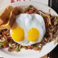 Homemade Corned Beef Hash · Chopped house-roasted corned beef grilled with peppers, onions and crispy hash browns. Comes...