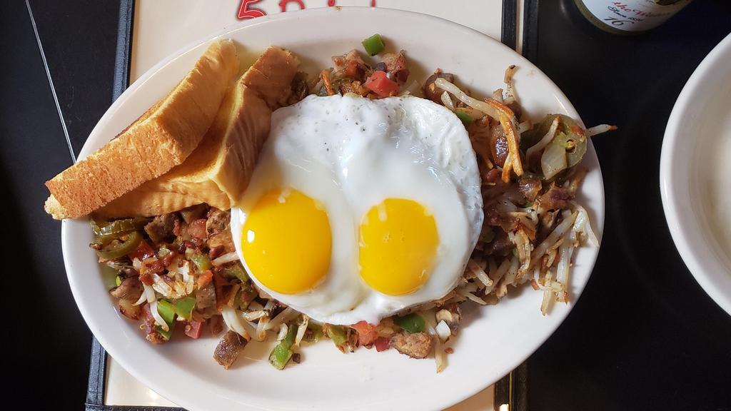 Homemade Corned Beef Hash · Chopped house-roasted corned beef grilled with peppers, onions and crispy hash browns. Come with two eggs and toast.