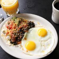 Huevos Rancheros · Two extra-large eggs any style on top of warmed corn tortillas layered with spicy black bean...