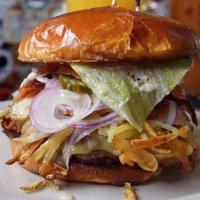 Havarti Breakfast Burger · Grilled hamburger on a brioche bun with a fried egg, hash browns, lettuce, tomato, onion, ba...