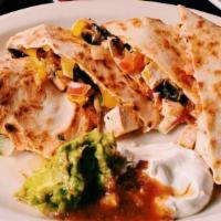 Chicken Quesadilla · One large grilled flour tortilla loaded with cheddar cheese, black olives, fresh pico de gal...
