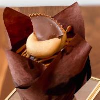 Chuck'S Peanut Butter · Chocolate cake filled with peanut butter mousse, dipped in ganache and topped with a Reece's...