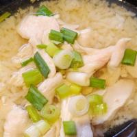 Chicken Rice Soup · Thai style porridge with mild seasoning, black pepper, green onions, and chicken.